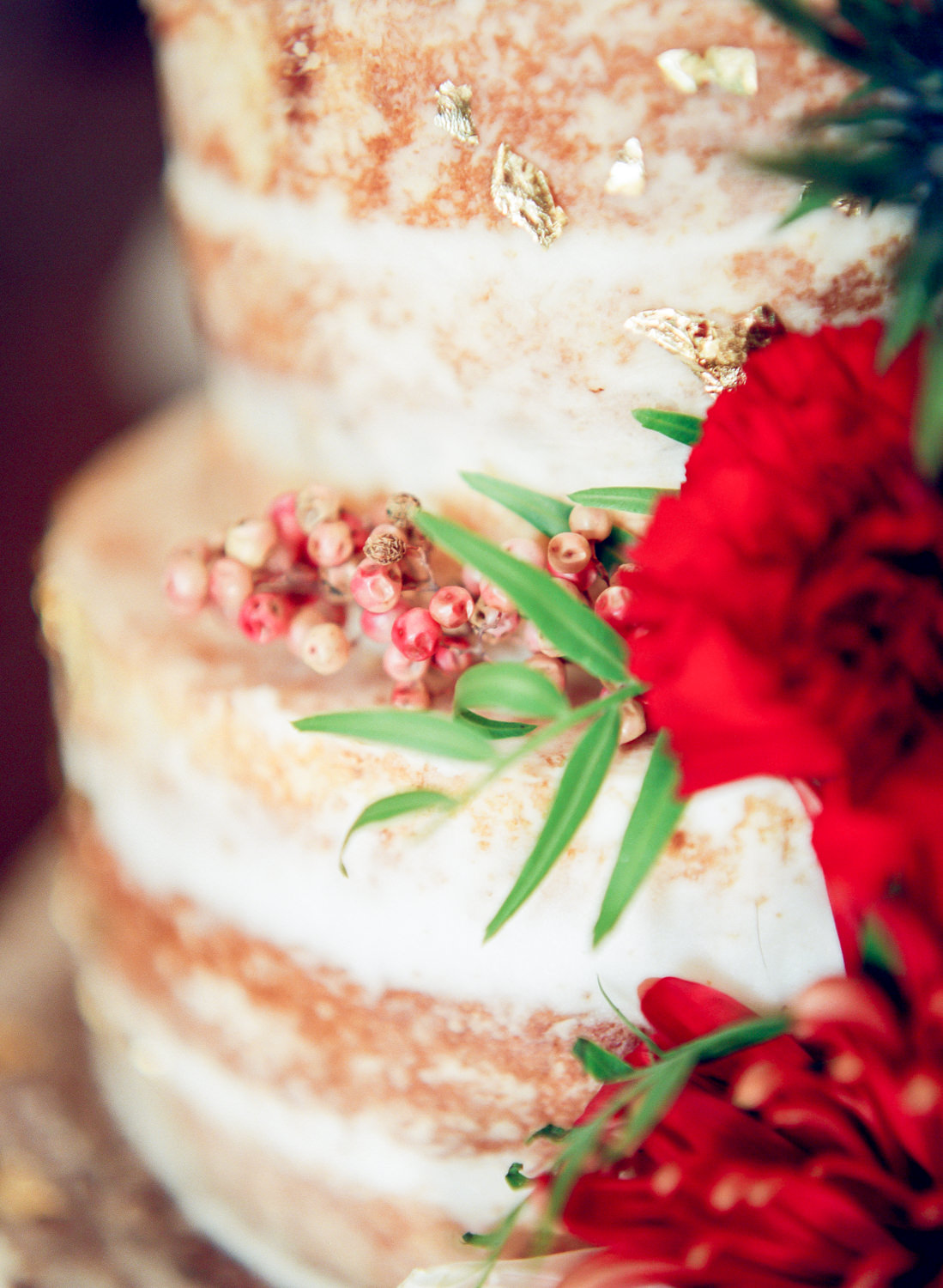 Sweet Design Bakery, naked wedding cake with berry sprigs and red flowers, Erica Robnett Photography