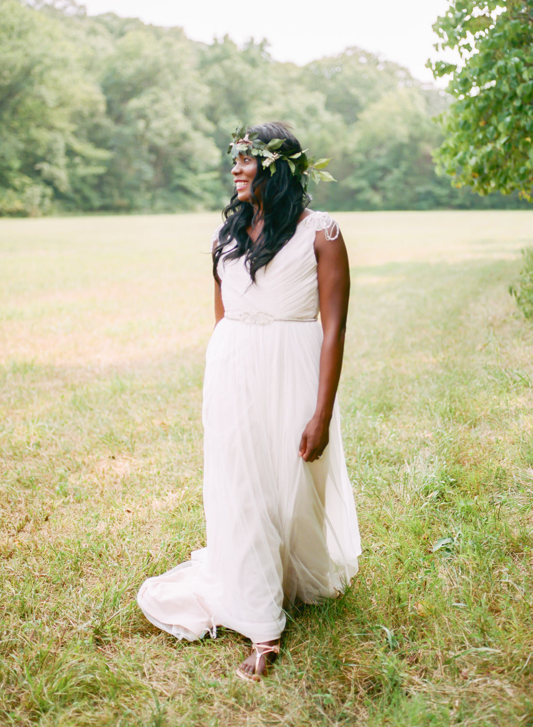 bride in grecian gown and leaf crown, walking in a field, St. Louis fine art wedding photography