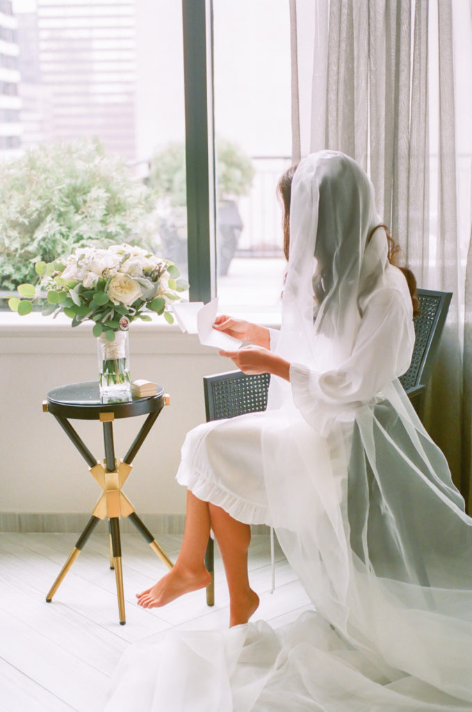 Bride reading letter from groom, Gwen Hotel Chicago, Erica Robnett Photography