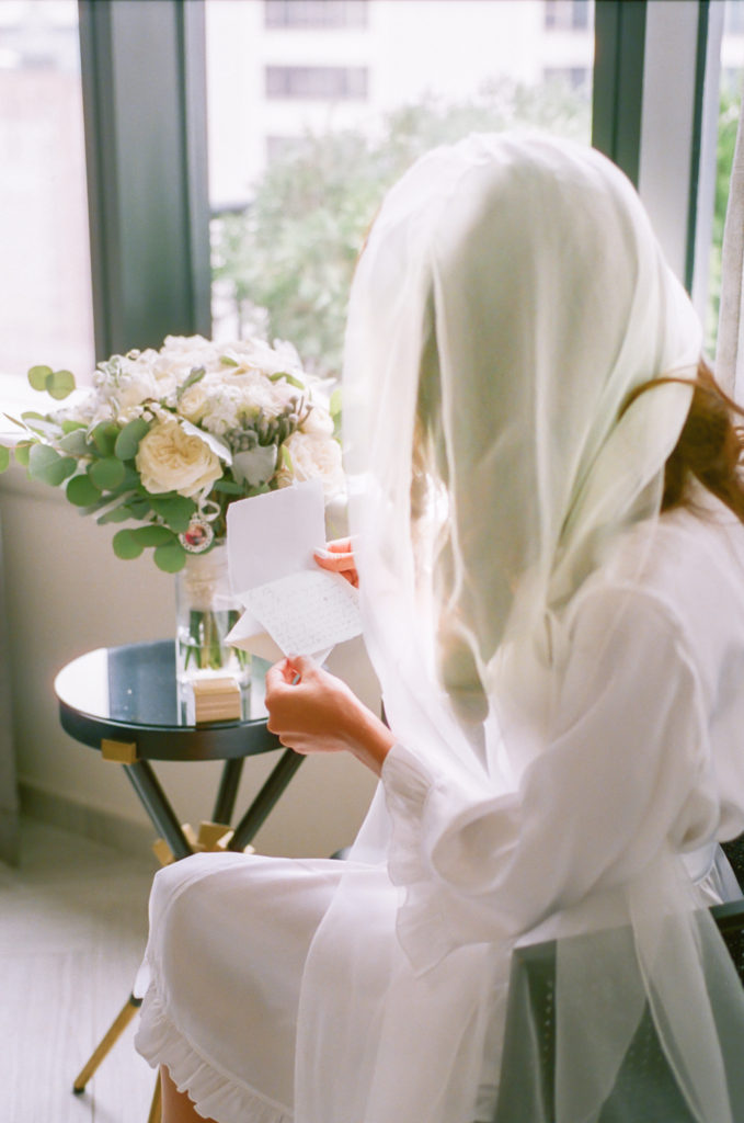 Bride reading letter from groom, Gwen Hotel Chicago, Erica Robnett Photography