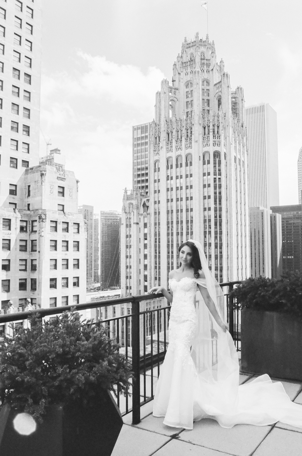 Bride at Gwen Hotel with Chicago skyline, Chicago fine art wedding photographer