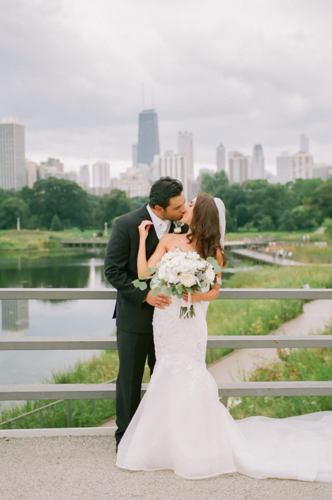Bride and Groom in Lincoln Park Chicago skyline, Chicago fine art wedding photographer