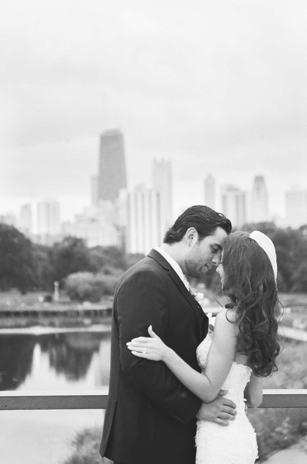 Bride and Groom in Lincoln Park Chicago skyline, Chicago fine art wedding photographer