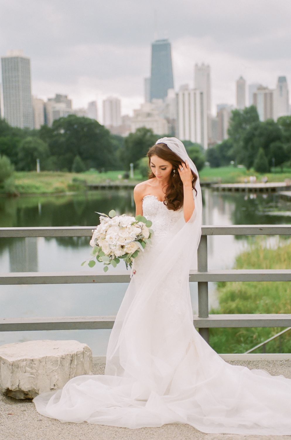 Bride in Lincoln Park Chicago skyline, Chicago fine art wedding photographer