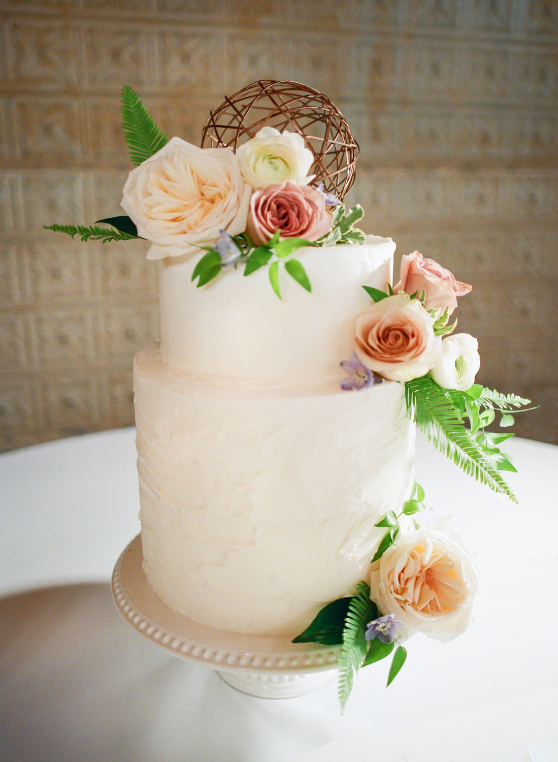 White wedding cake with pink pastel flowers by Farmgirl Floral and Decor, St. Louis Film Photographer Erica Robnett Photography