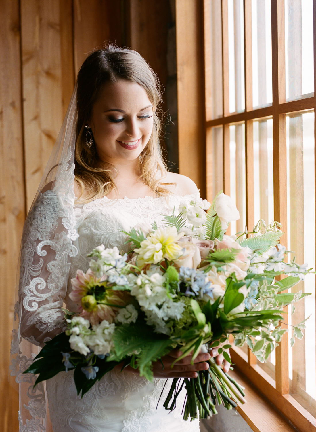 Bridal portrait at Mighty Oak Lodge with Farmgirl Floral pastel bouquet, St. Louis Fine Art Film Wedding Photographer