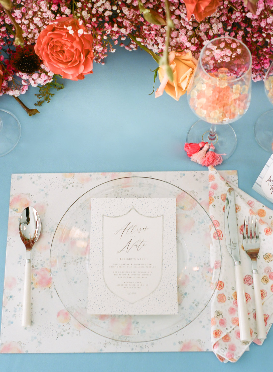 Whimsical coral flower napkins and reception menu by Lo in London, St. Louis film wedding photographer