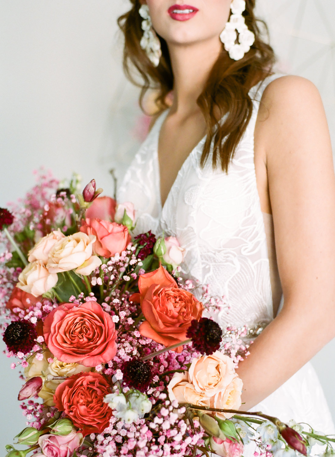 Coral, peach, and pink bridal bouquet by Lavish Floral Design, I Do Bridal gown, St. Louis fine art film wedding photographer Erica Robnett Photography