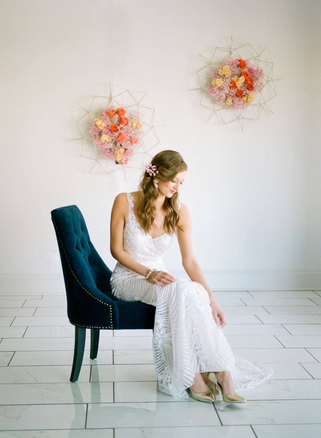 Bride in blue chair wearing I Do Bridal gown, St. Louis fine art film wedding photographer Erica Robnett Photography