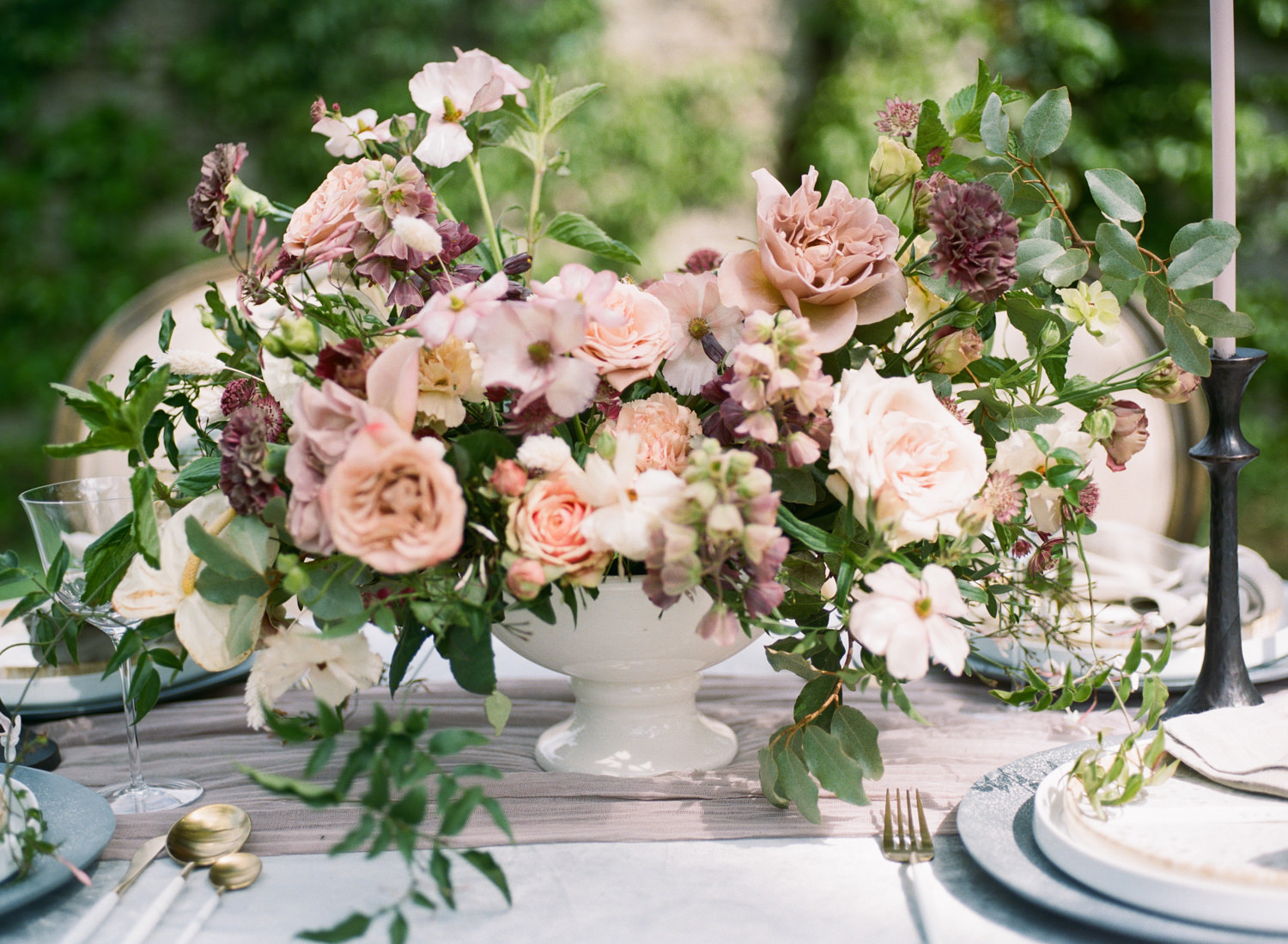 Dusty mauve, pink classic outdoor reception floral arrangement by Magnolia Belle Floral, Dusty blue with gold accent wedding reception dinnerware, gold silverware, classic wedding reception, St Louis Fine Art Film Wedding Photographer Erica Robnett Photography