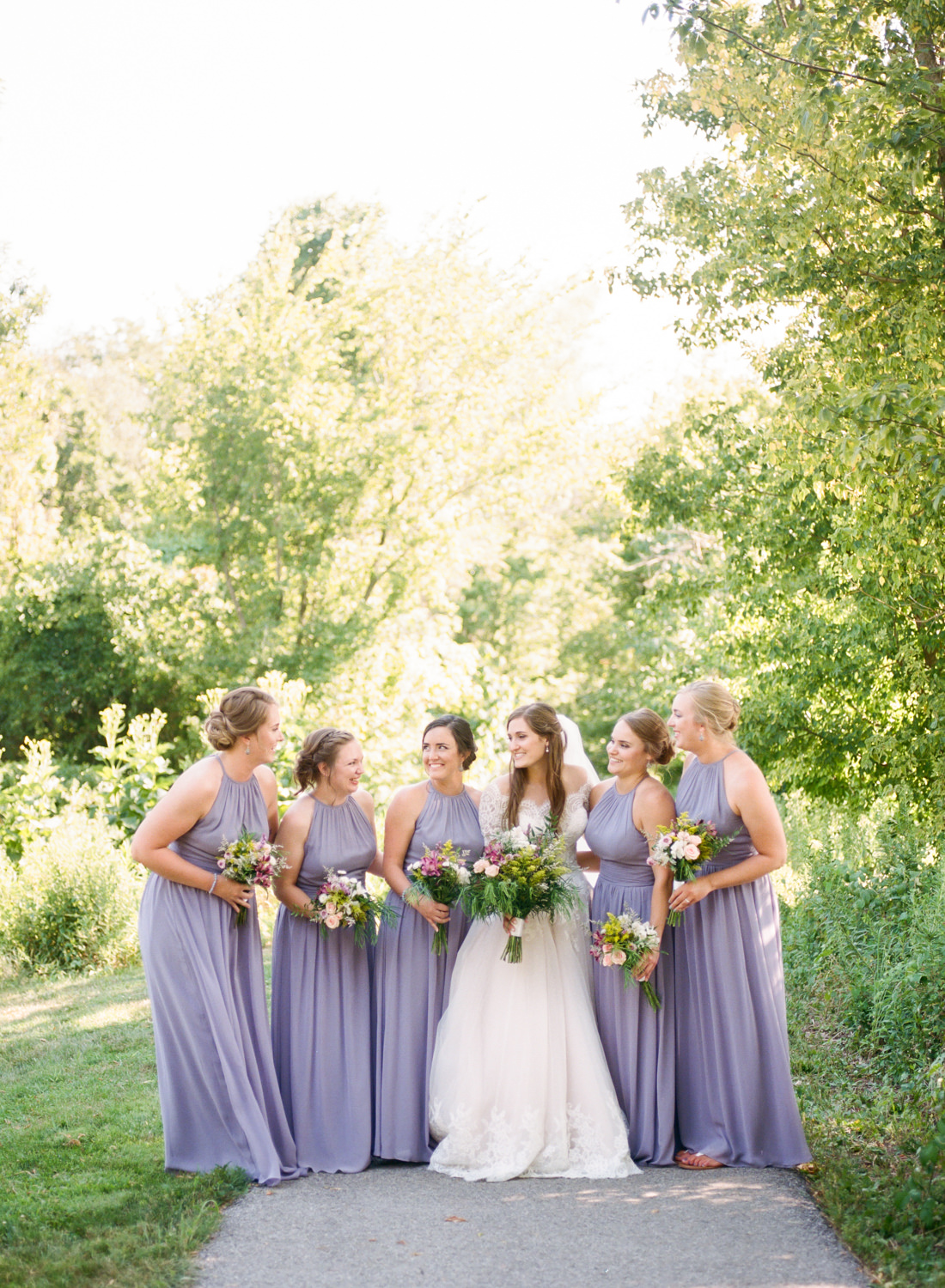Bride and bridesmaids in lavender dresses; St. Louis fine art film wedding photographer Erica Robnett Photography