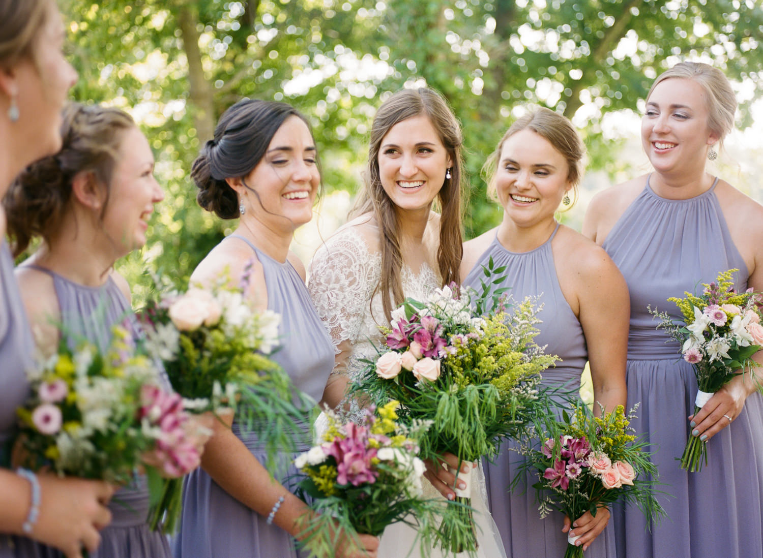 Bride laughing with bridesmaids; St. Louis fine art film wedding photographer Erica Robnett Photography