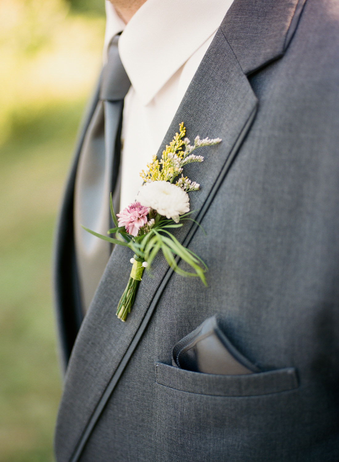 Wildflower groom's boutonniere; St. Louis film wedding photographer Erica Robnett Photography