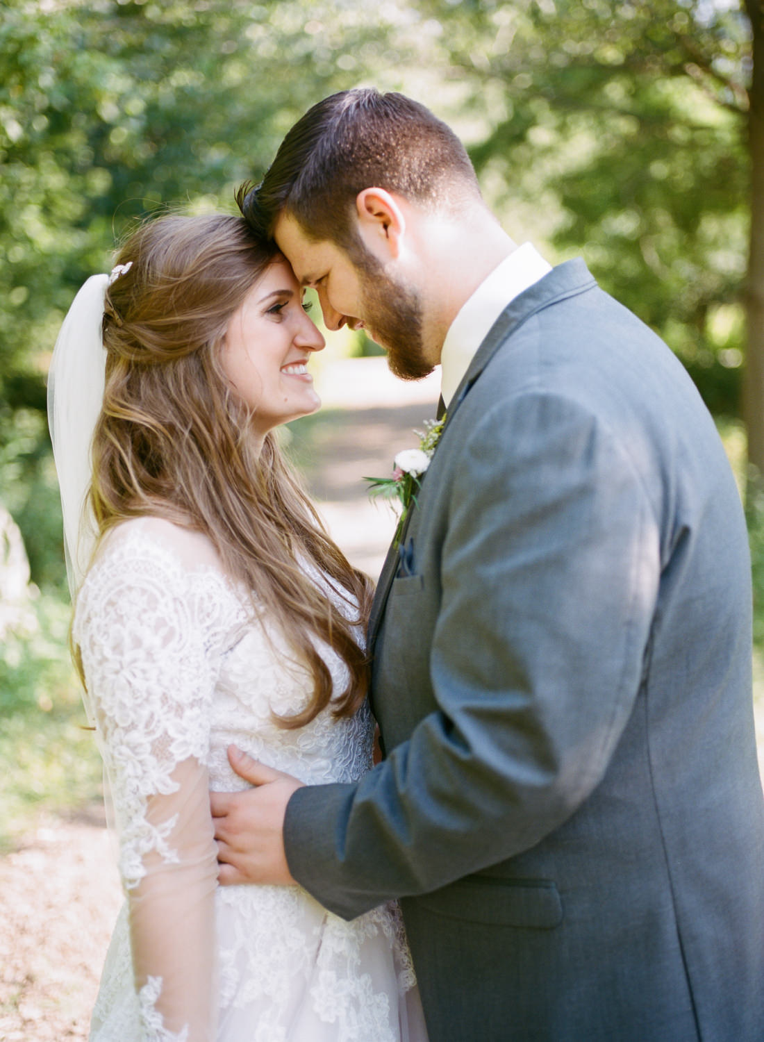Bride and groom snuggling; St. Louis fine art film wedding photographer Erica Robnett Photography