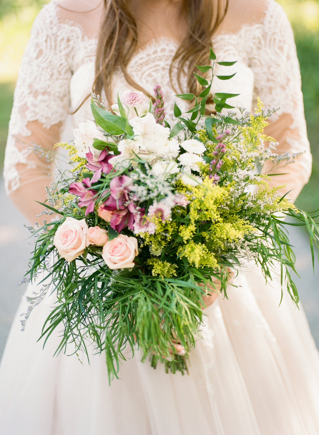 Bride with wildflower bouquet; St. Louis fine art film wedding photographer Erica Robnett Photography