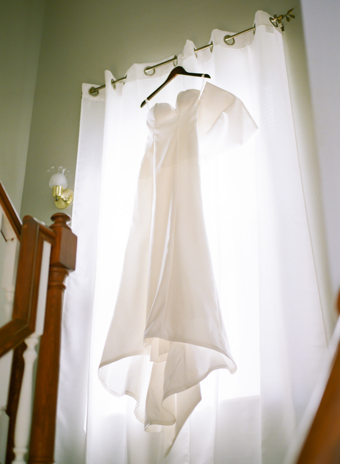 Wedding dress in window; St. Louis wedding photographer