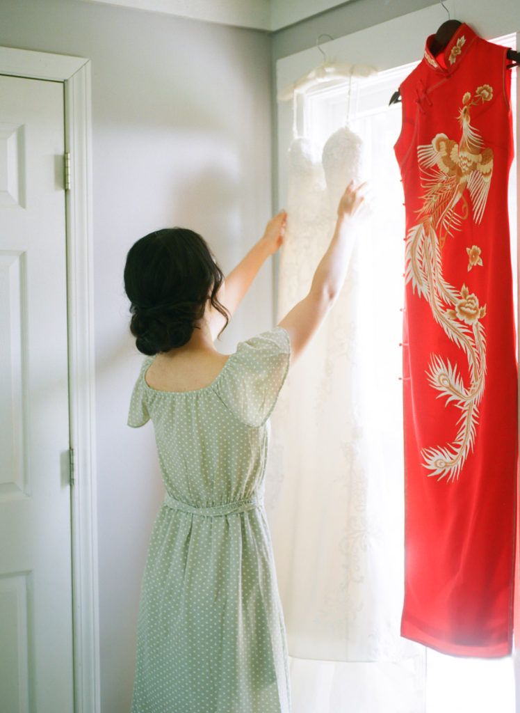 Bride reaching for wedding dress; St. Louis fine art film wedding photographer Erica Robnett Photography