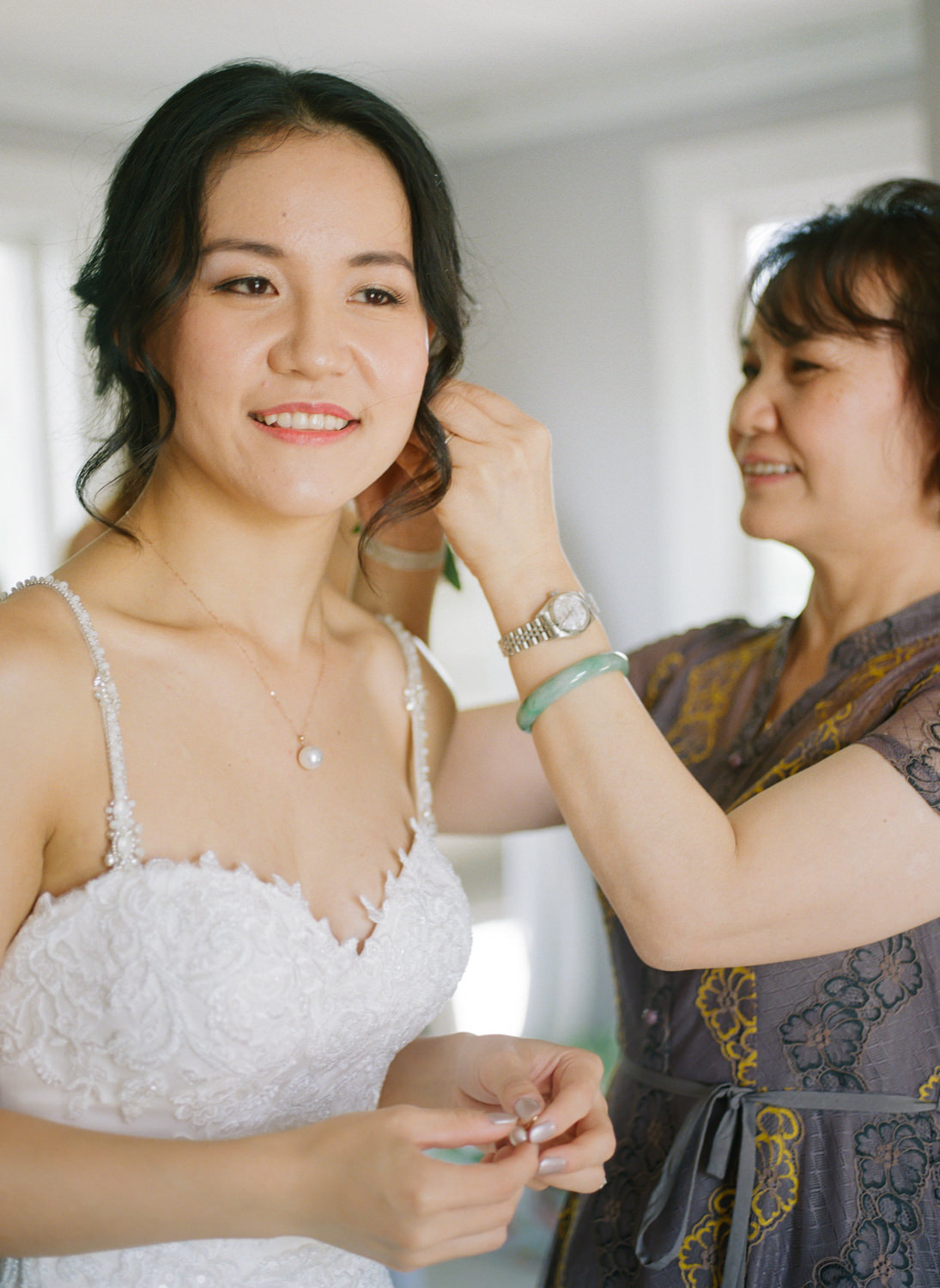 Bride getting ready with mother; St. Louis fine art film wedding photographer Erica Robnett Photography