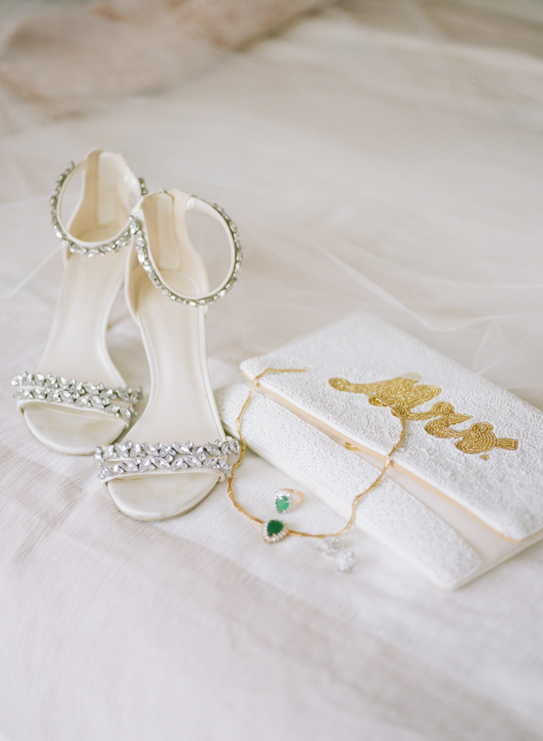 Jeweled bridal shoe and white Mrs.. bridal purse; St. Louis wedding photographer