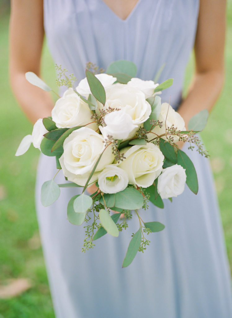 White and green bridesmaid bouquet with dusty blue dress; St. Louis fine art film wedding photographer Erica Robnett Photography
