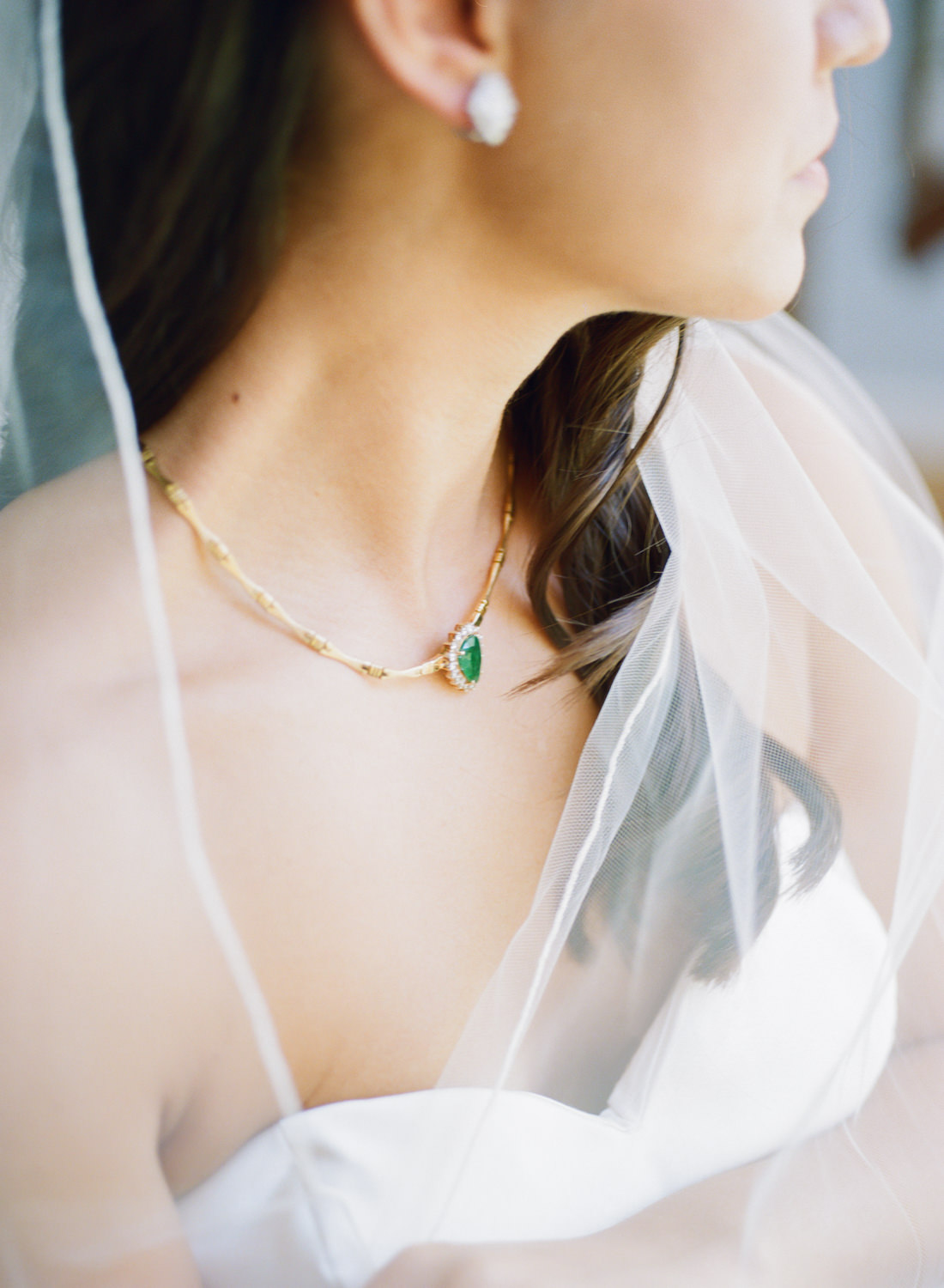Bride wearing green and gold necklace; St. Louis fine art film wedding photographer Erica Robnett Photography