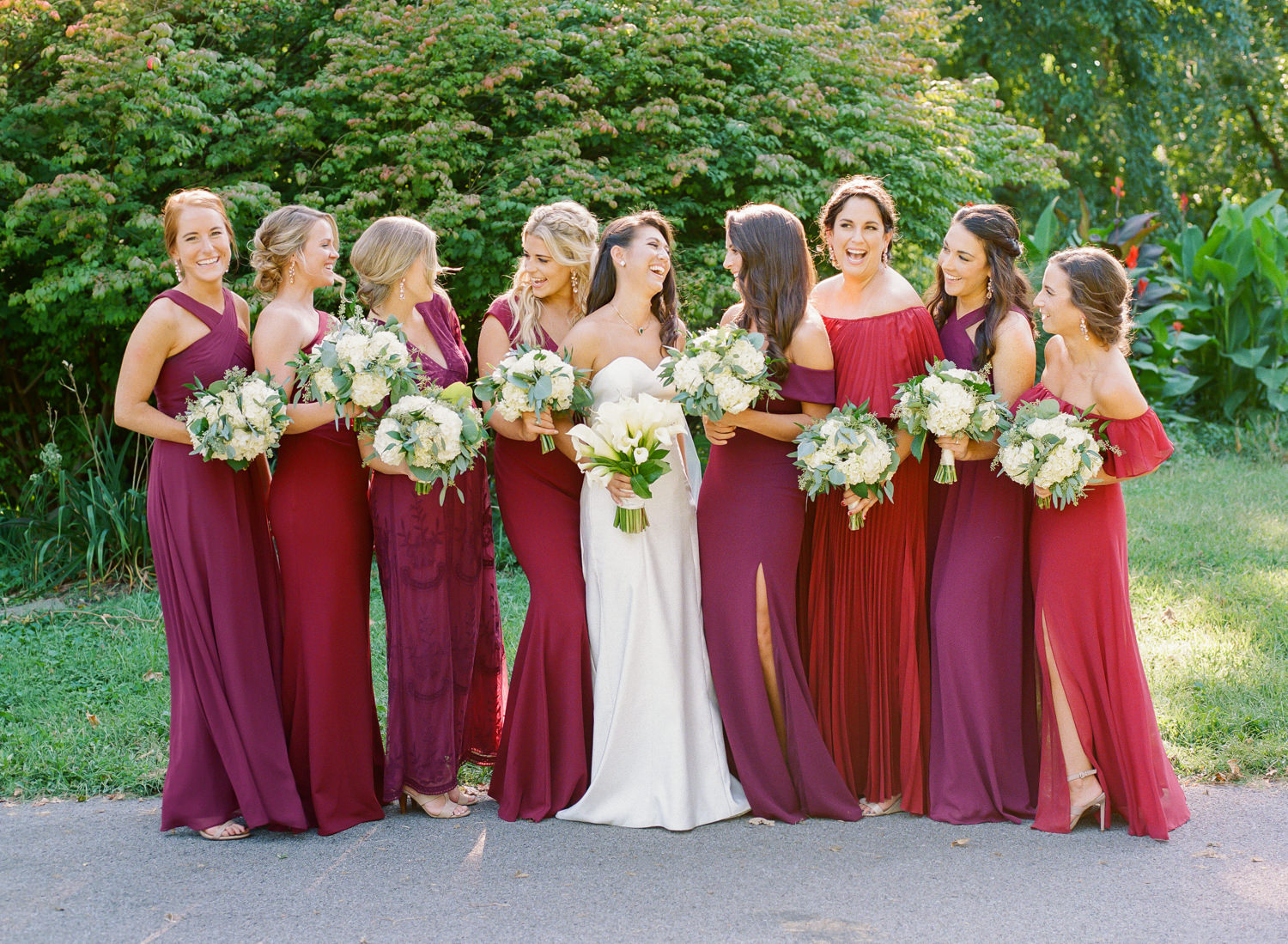 Bridesmaids in cranberry dresses at Lafayette Park, St. Louis wedding photographer
