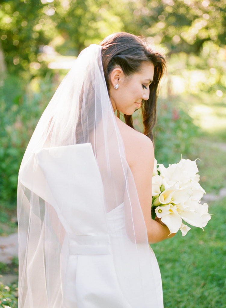 Bridal portrait at Lafayette Park, back of dress in sunlight; St. Louis fine art film wedding photographer Erica Robnett Photography
