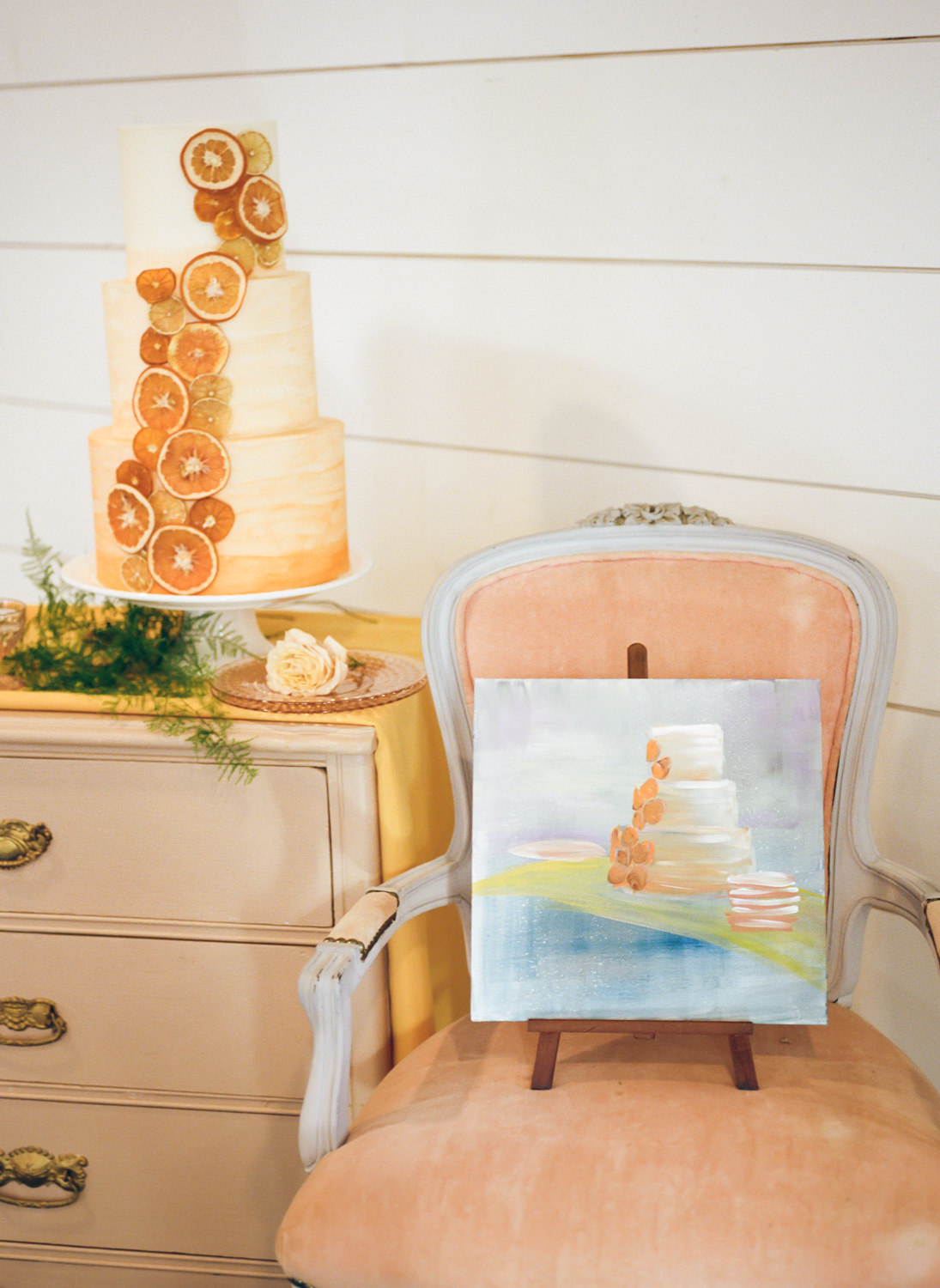 Citrus wedding cake and wedding paintings by Cindy Scott Artistry; St. Louis fine art film wedding photographer