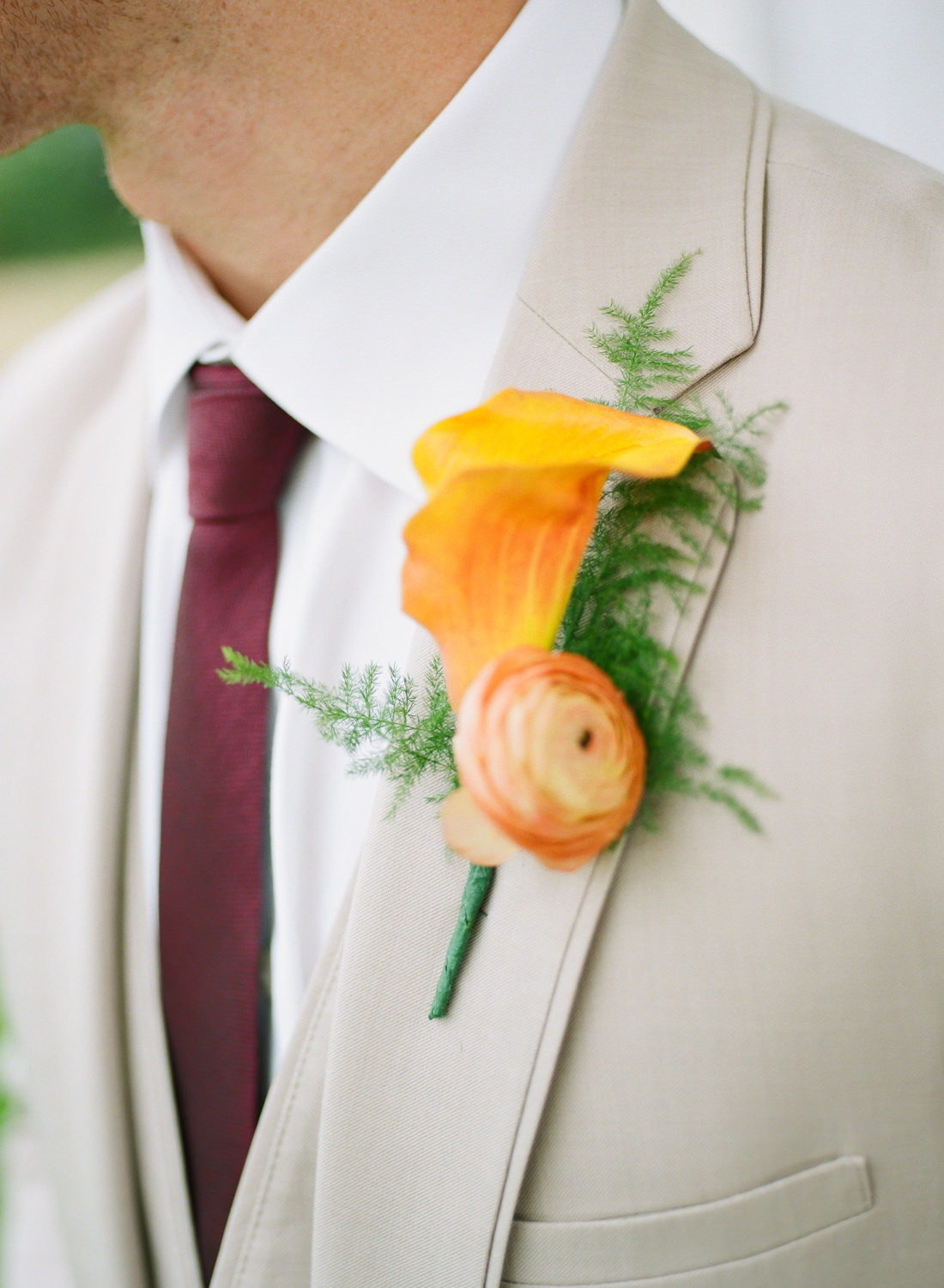 Groom's tropical orange boutonniere, St. Louis fine art film wedding photographer Erica Robnett Photography