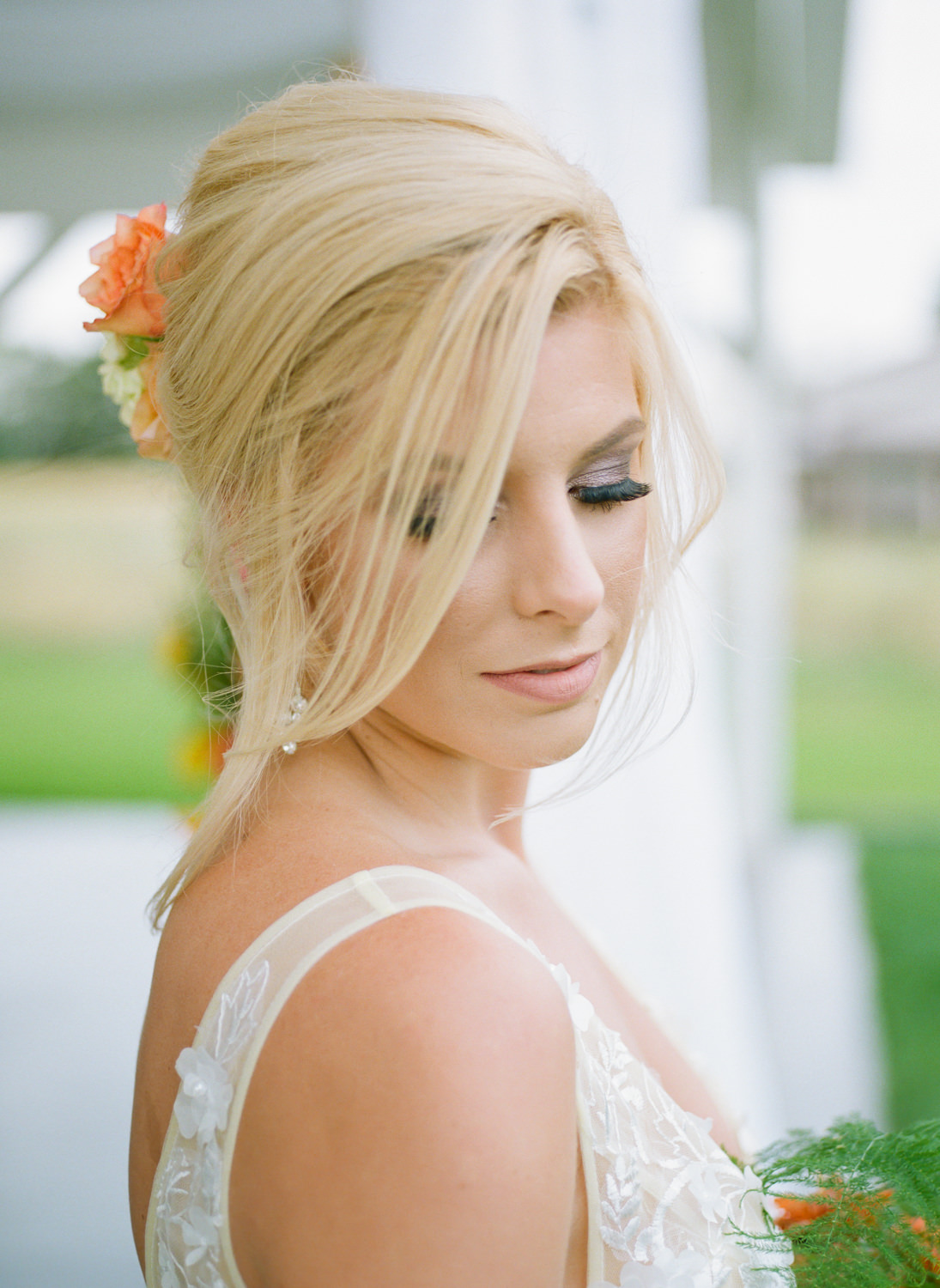 Bridal hair with brightly colored flowers; St. Louis fine art film wedding photographer Erica Robnett Photography
