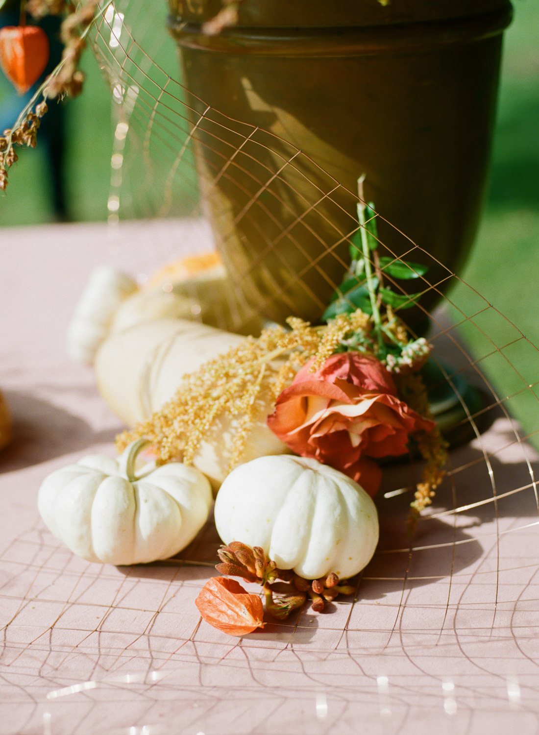 Pumpkin decor, red autumn florals, Thanksgiving table pumpkins at Emerson Fields; St. Louis fine art film wedding photographer Erica Robnett Photography