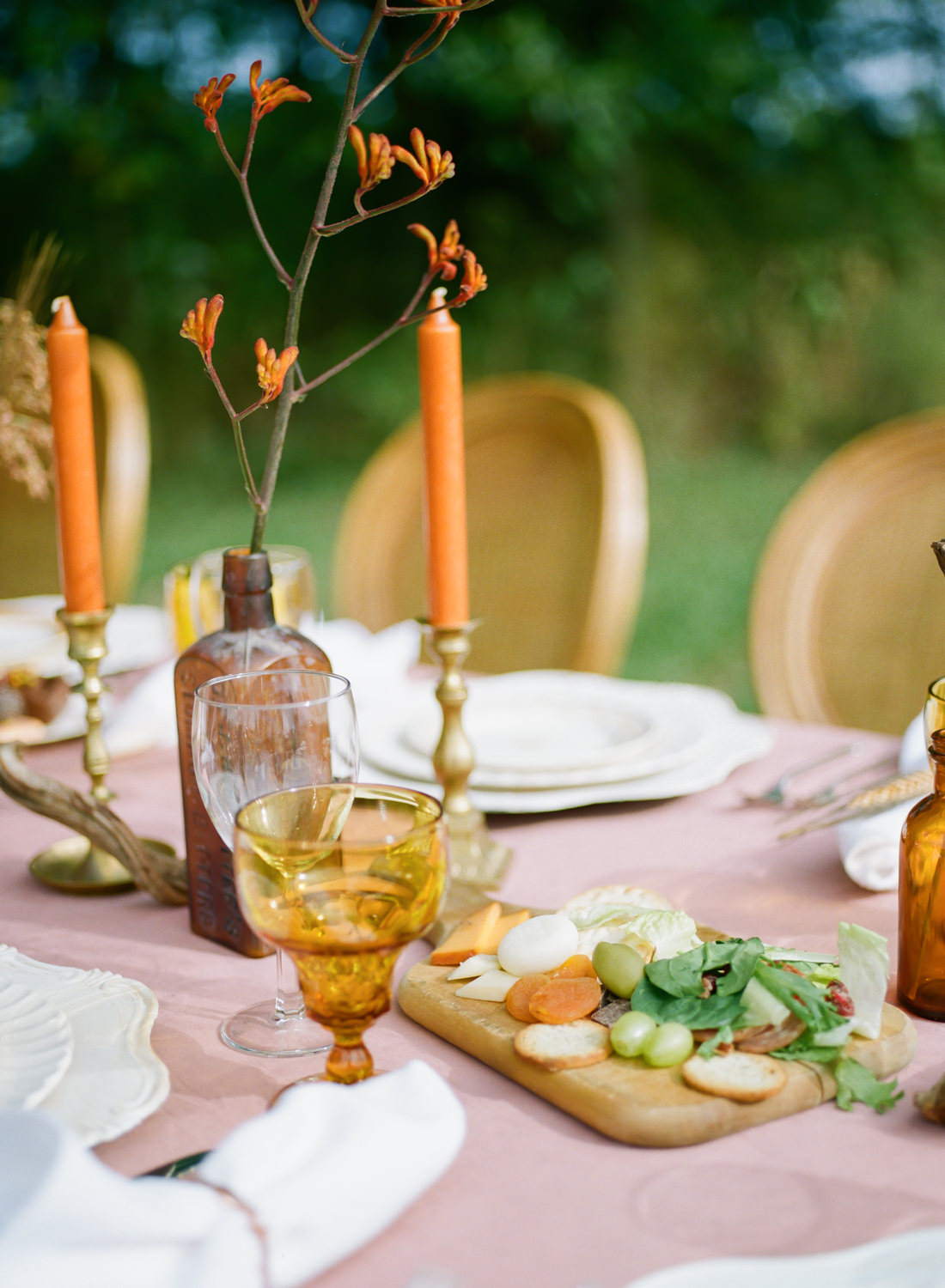 Amber colored glass, orange taper candles, autumn florals, vintage china, rose velvet tablecloth, pumpkin decor; Thanksgiving table at Emerson Fields; St. Louis fine art film wedding photographer Erica Robnett Photography