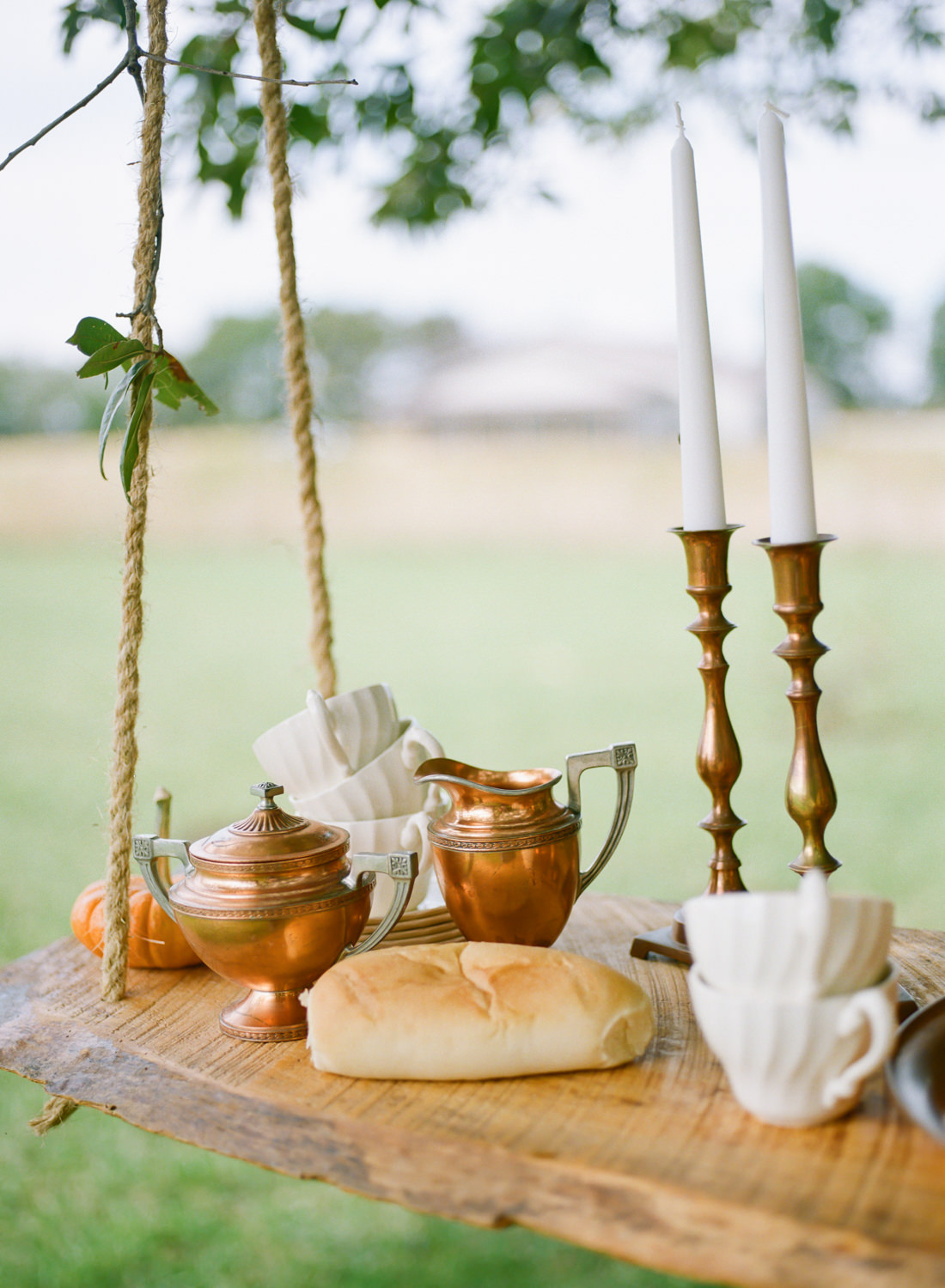 Copper serving dishes, bread loaf, white china, Thanksgiving table at Emerson Fields; St. Louis fine art film wedding photographer Erica Robnett Photography
