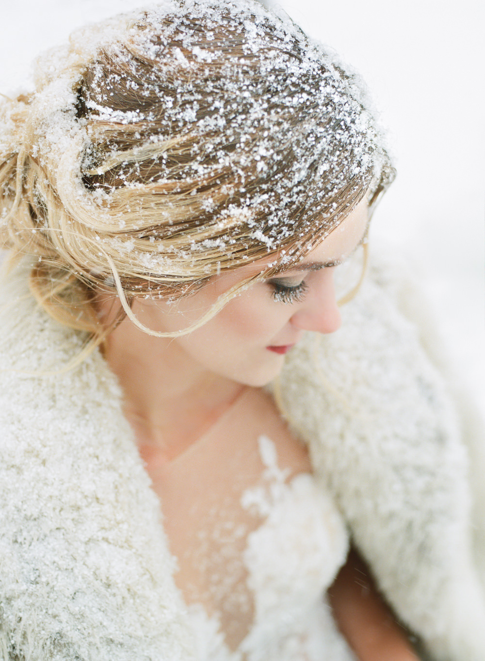 Winter wedding, Bride with fur coat in snow; St. Louis fine art film wedding photographer Erica Robnett Photography