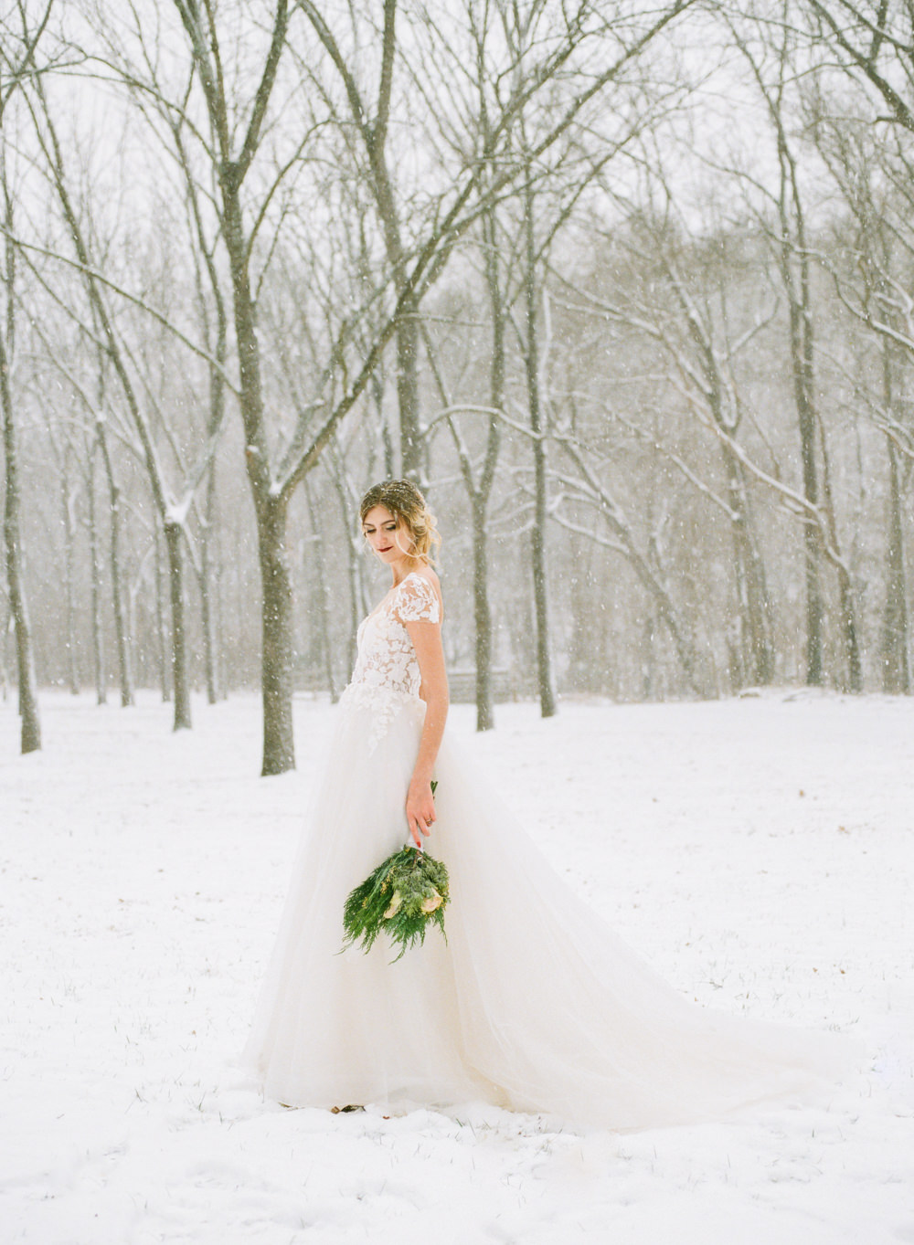 Winter wedding, bride in snow wearing floral illusion gown; St. Louis fine art film wedding photographer Erica Robnett Photography
