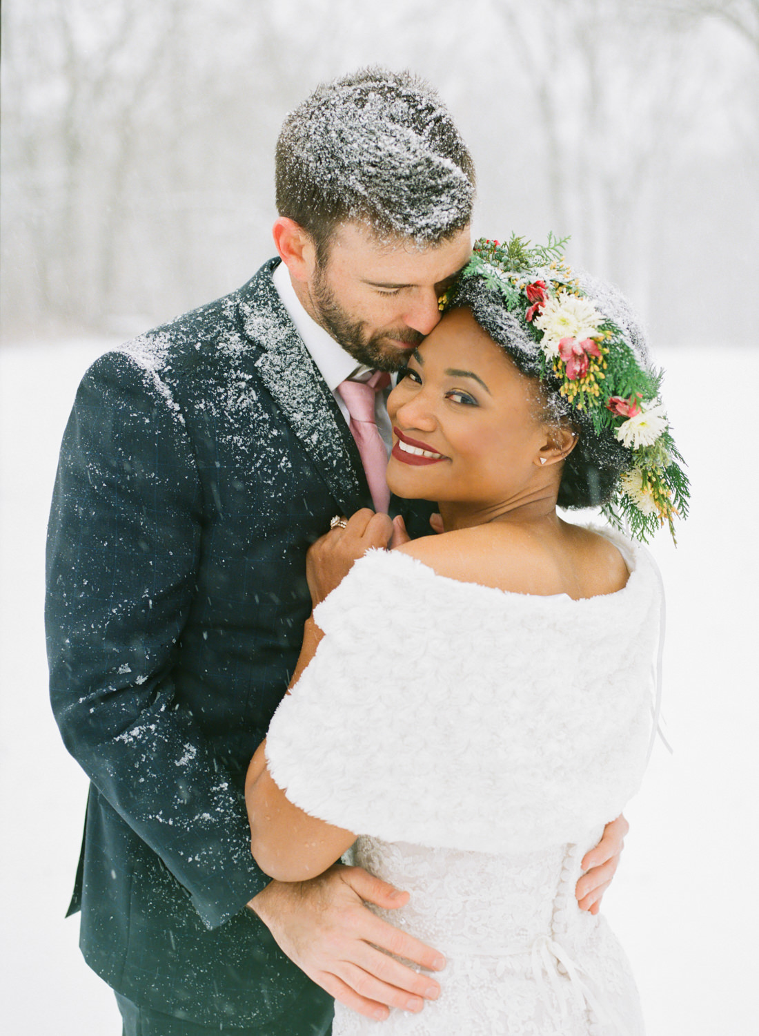 Winter wedding bride with flower crown and groom in snow; St. Louis fine art film wedding photographer Erica Robnett Photography