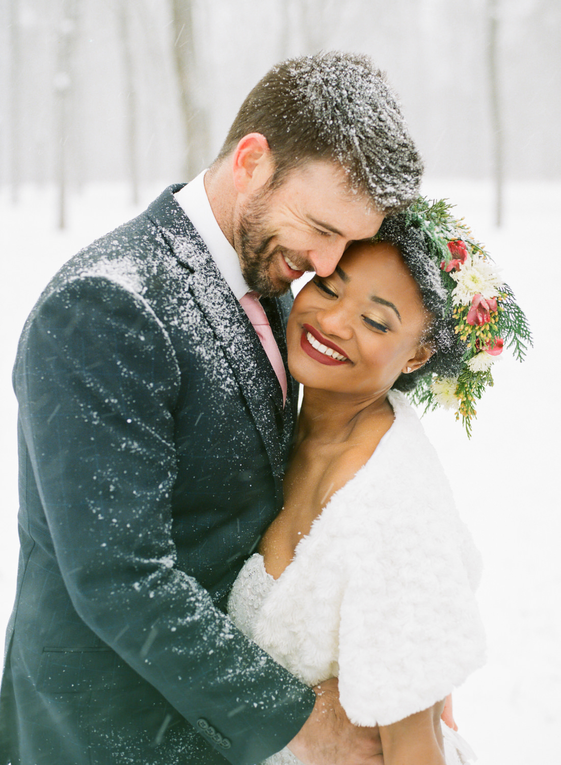 Winter wedding bride with flower crown and groom in snow; St. Louis fine art film wedding photographer Erica Robnett Photography