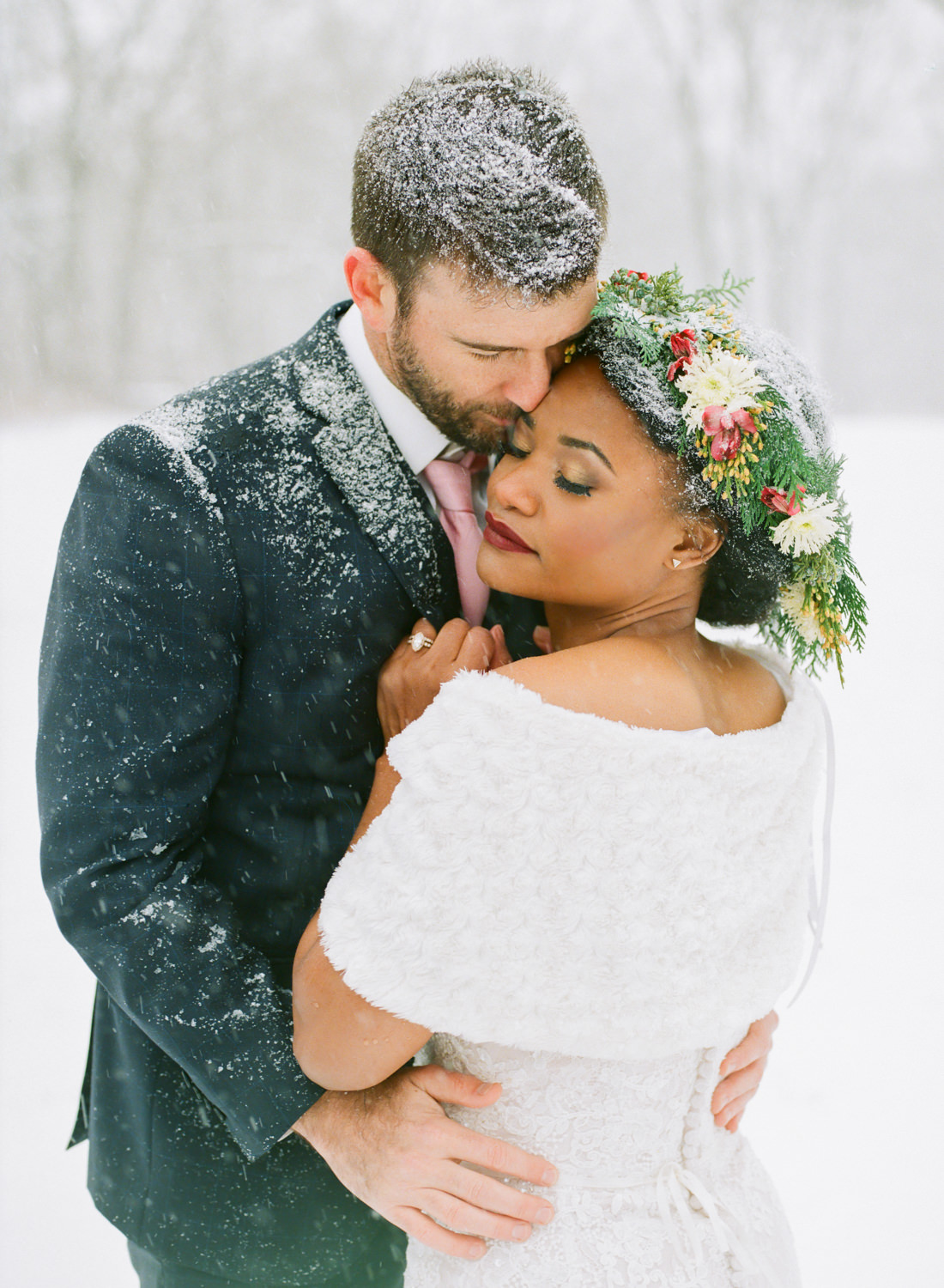 Winter wedding bride in flower crown and groom in snow; St. Louis fine art film wedding photographer Erica Robnett Photography