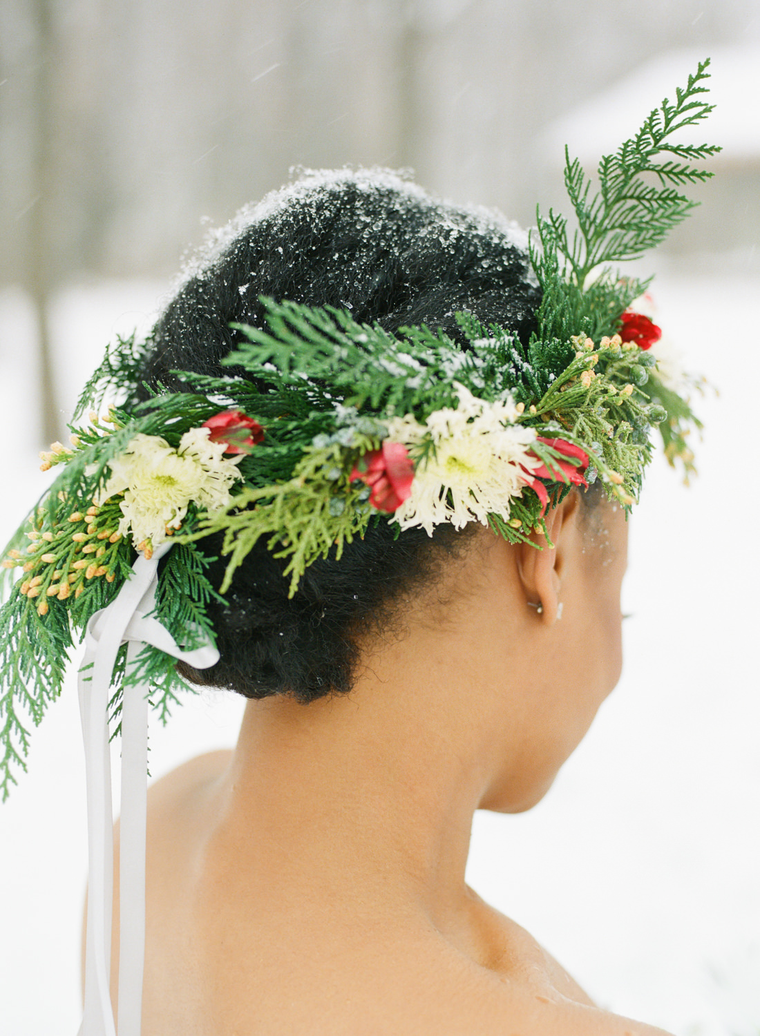 Bride with flower crown in snow; St. Louis fine art film wedding photographer Erica Robnett Photography
