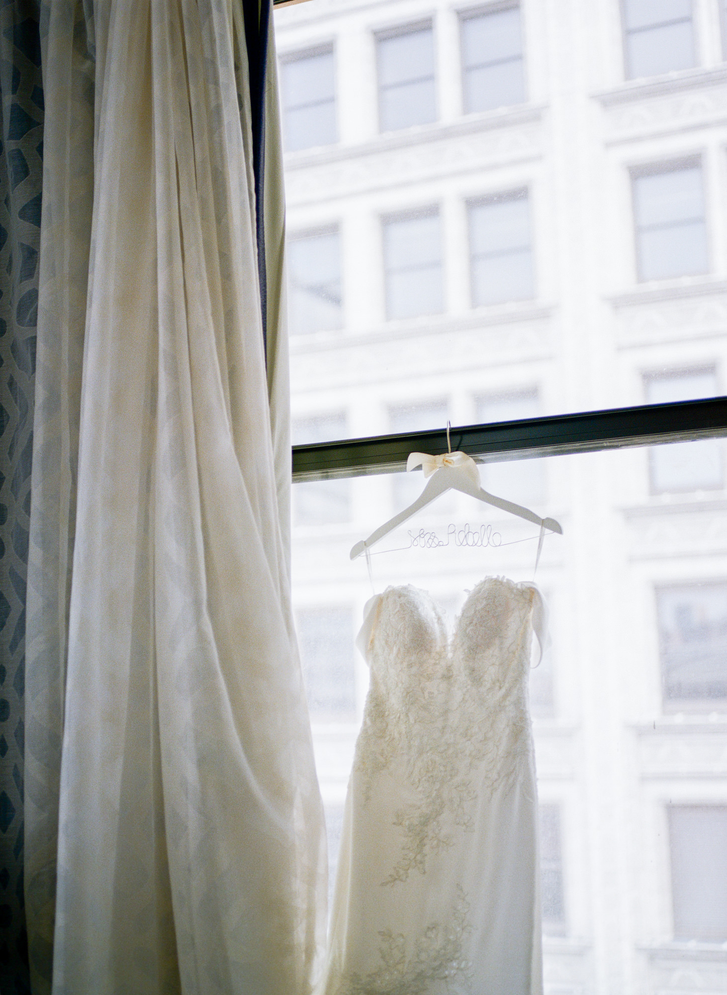 Wedding dress in window of Hotel St. Louis; St. Louis fine art film wedding photographer Erica Robnett Photography