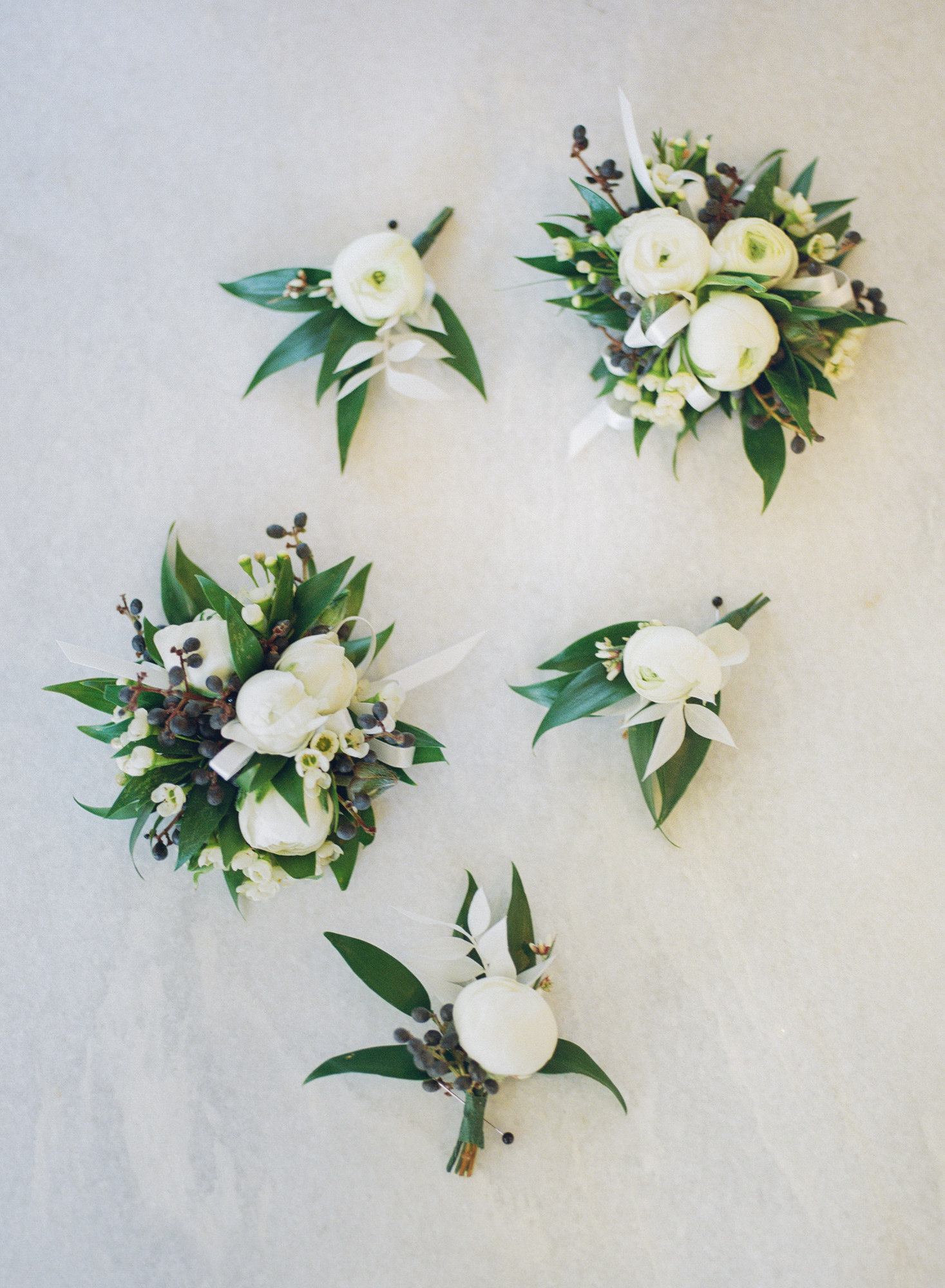 White wedding corsages; St. Louis fine art film wedding photographer Erica Robnett Photography