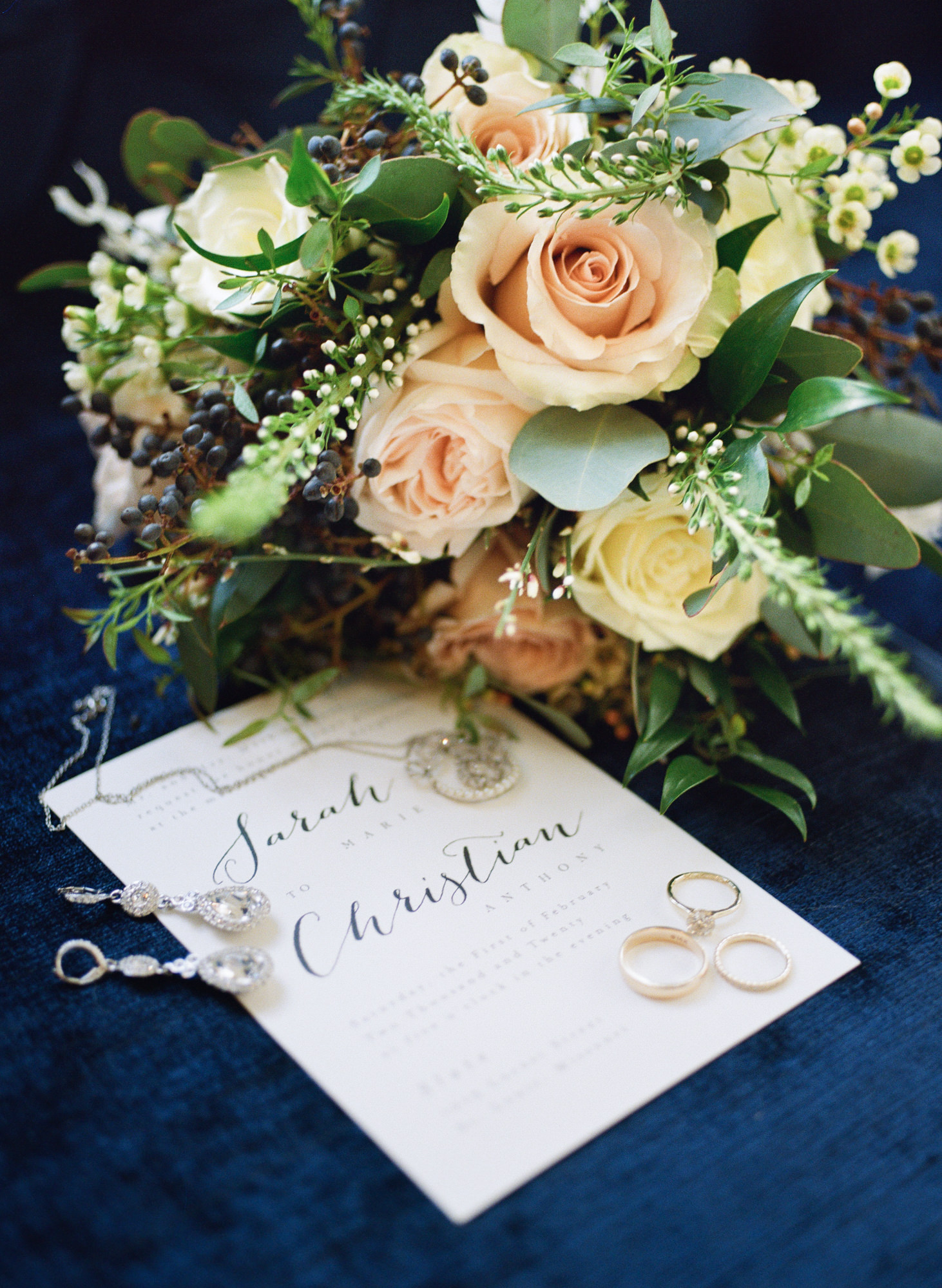 Modern white wedding invitation, wedding jewelry, and pastel bouquet; St. Louis fine art film wedding photographer Erica Robnett Photography