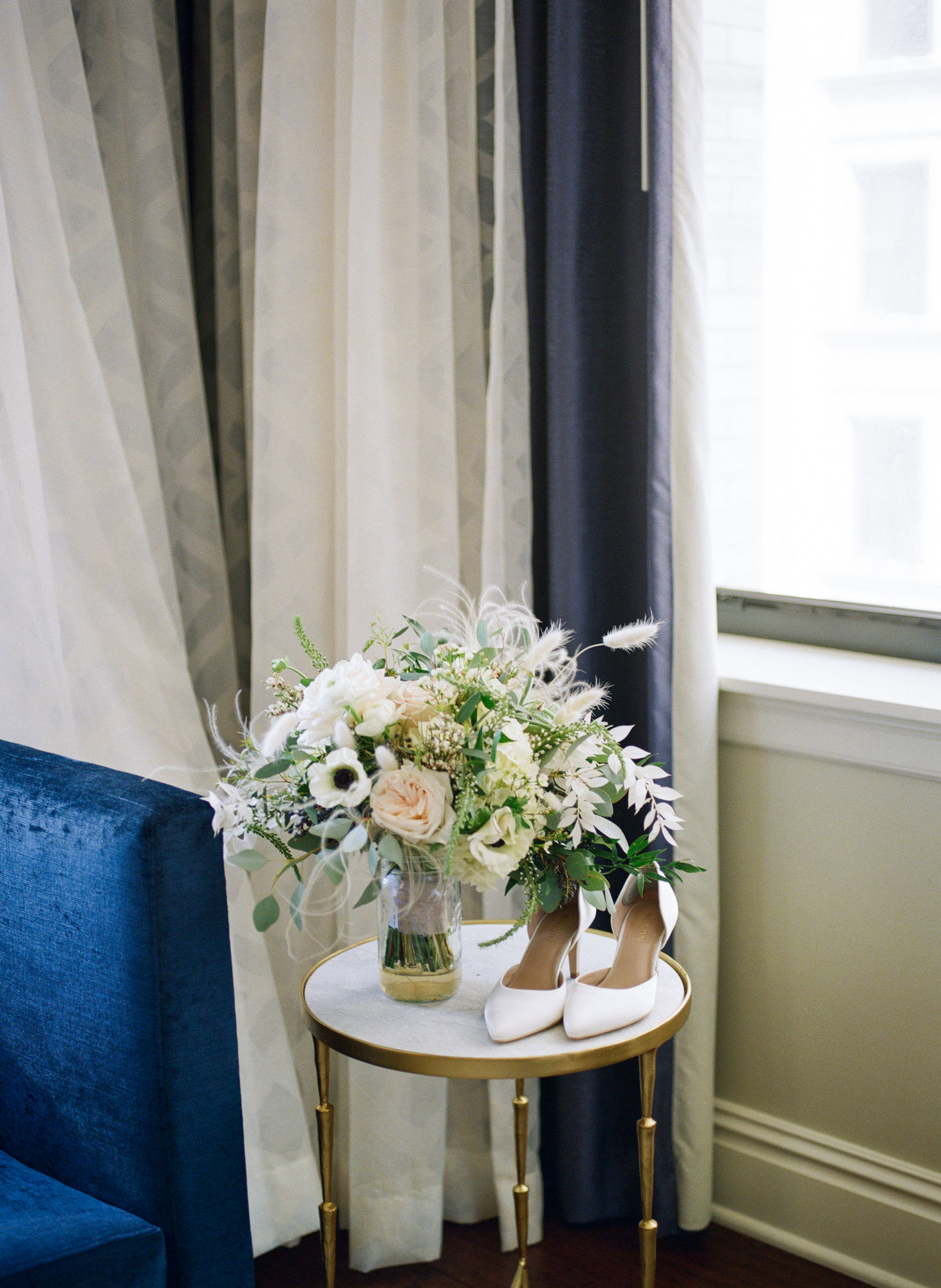 White and pastel wedding bouquet at Hotel St. Louis; St. Louis fine art film wedding photographer Erica Robnett Photography