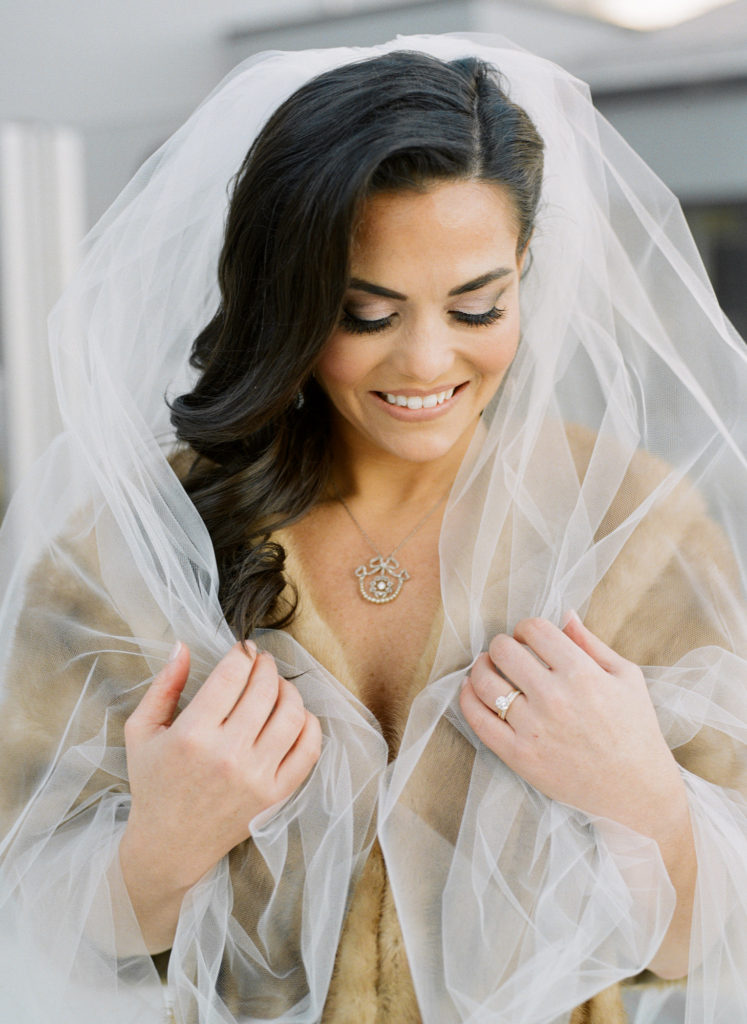 Winter bridal portrait with antique shawl on rooftop of Hotel St. Louis; St. Louis fine art film wedding photographer Erica Robnett Photography