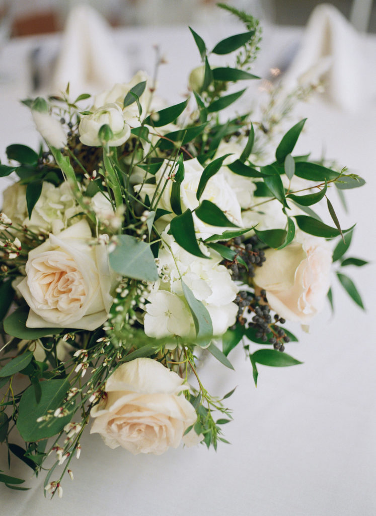 White and peach flowers decor at Willow St. Louis wedding reception; St. Louis fine art film wedding photographer Erica Robnett Photography