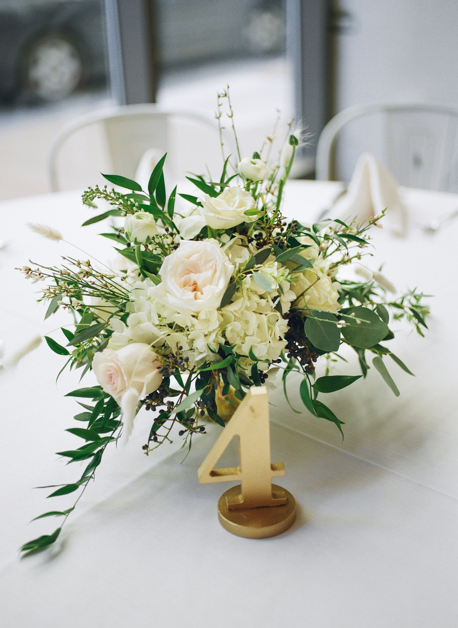 White flowers and gold table number decor at Willow St. Louis wedding reception; St. Louis fine art film wedding photographer Erica Robnett Photography