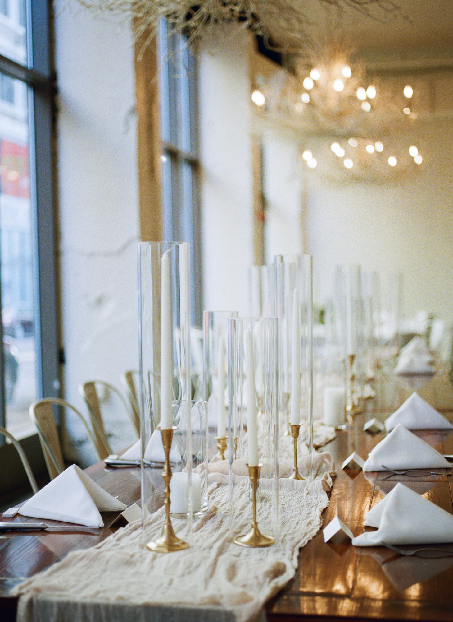 Tall candle vases decor at Willow St. Louis wedding reception; St. Louis fine art film wedding photographer Erica Robnett Photography