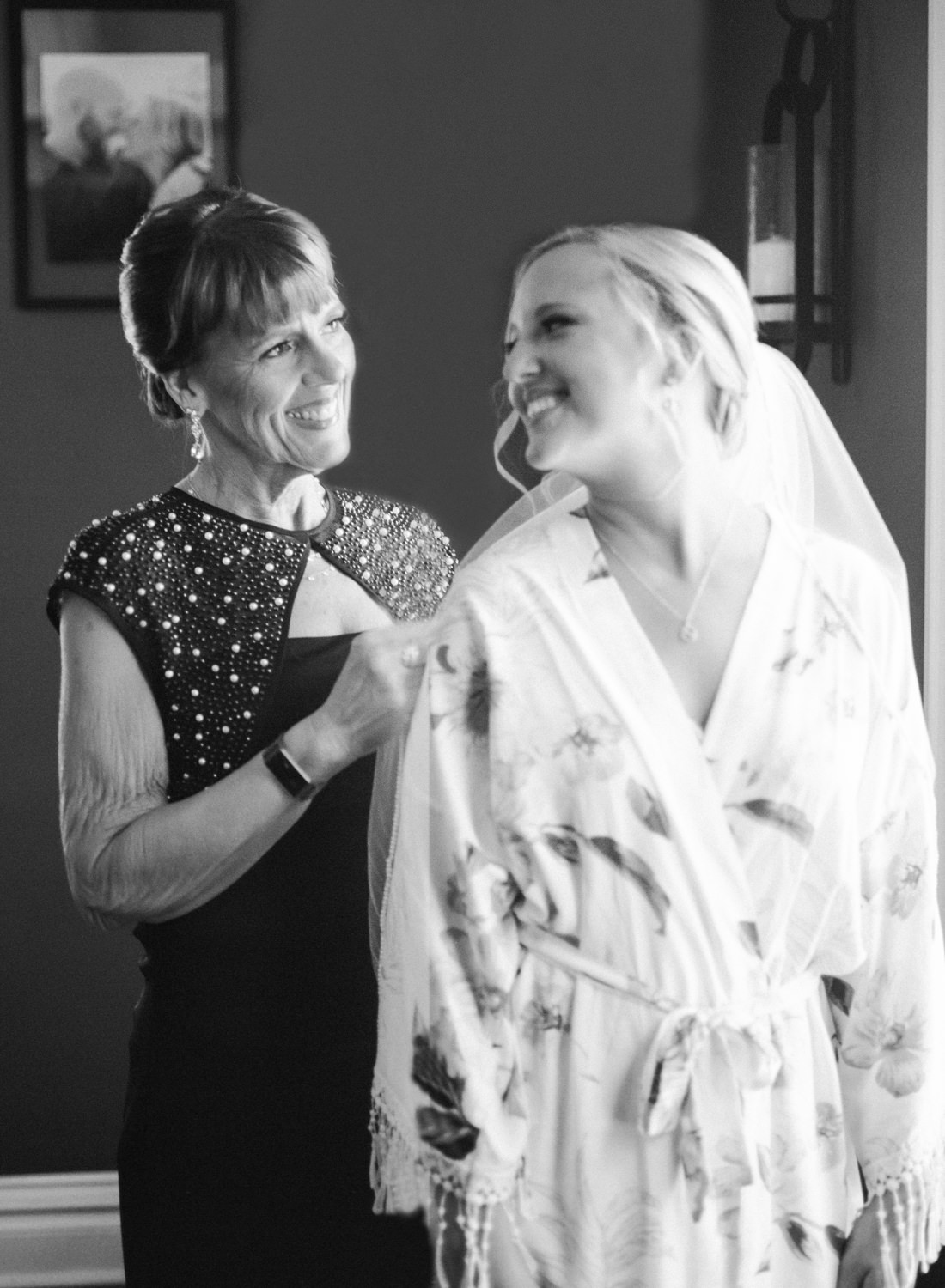 Mom helping bride with veil; St. Louis wedding photographer