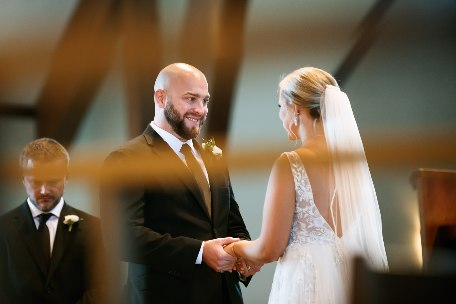 Groom looking at bride; St. Louis wedding photographer