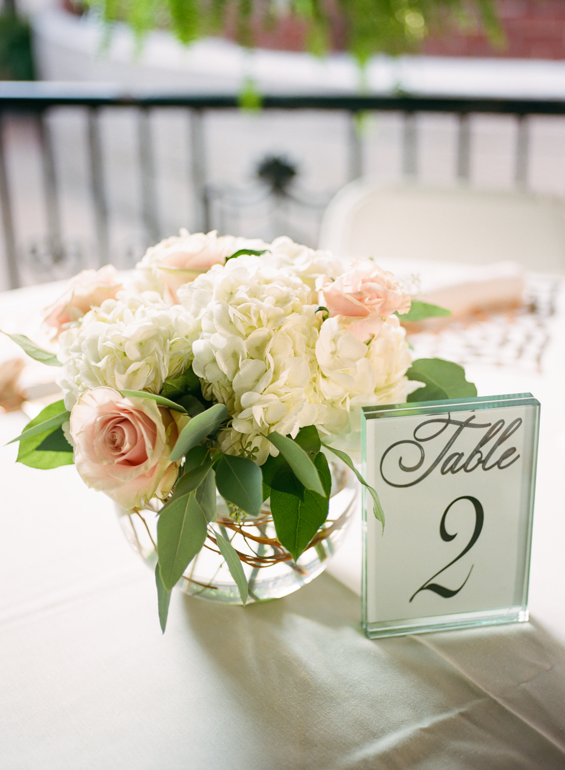 Pink and white wedding reception flowers; St. Louis wedding photographer